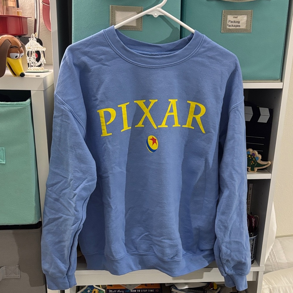 PIXAR Blue Crewneck Sweater with Yellow Accents